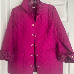 Chico's dahlia color tailored classic mid-length, quilted lining. Contrast trim.